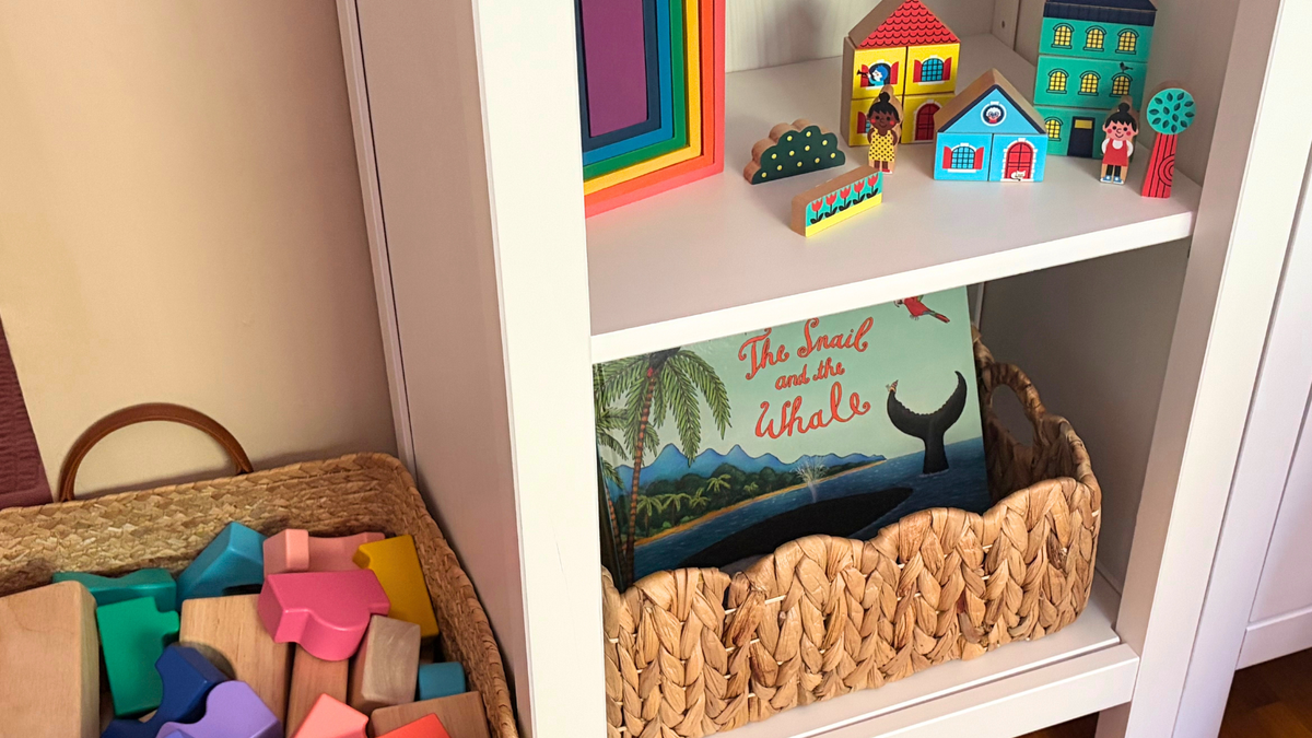 Acorn to sprout story based and play based book basket with toy blocks