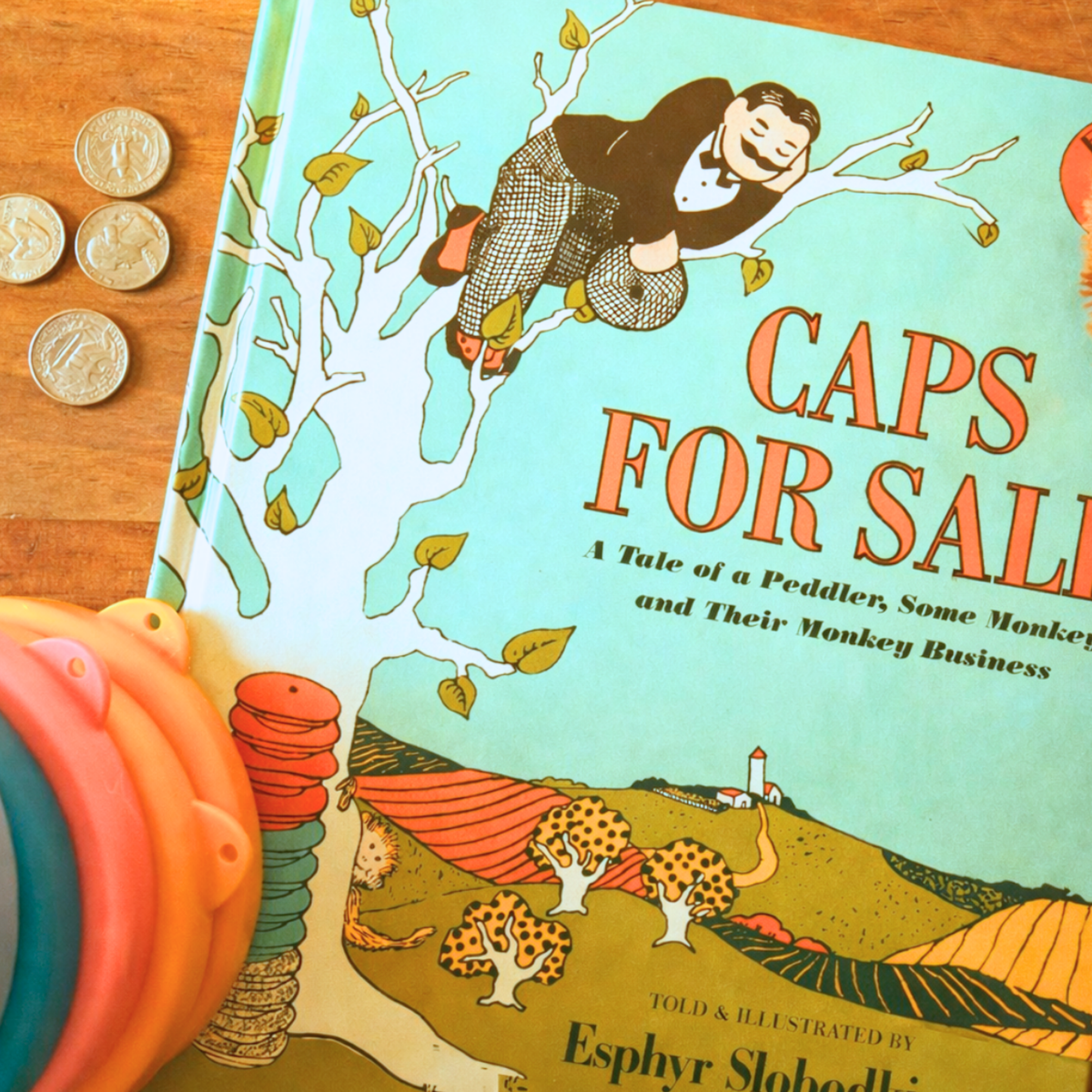 Caps for Sale by Esphyr Slobodkina styled with colorful stacking hats and counting pieces.