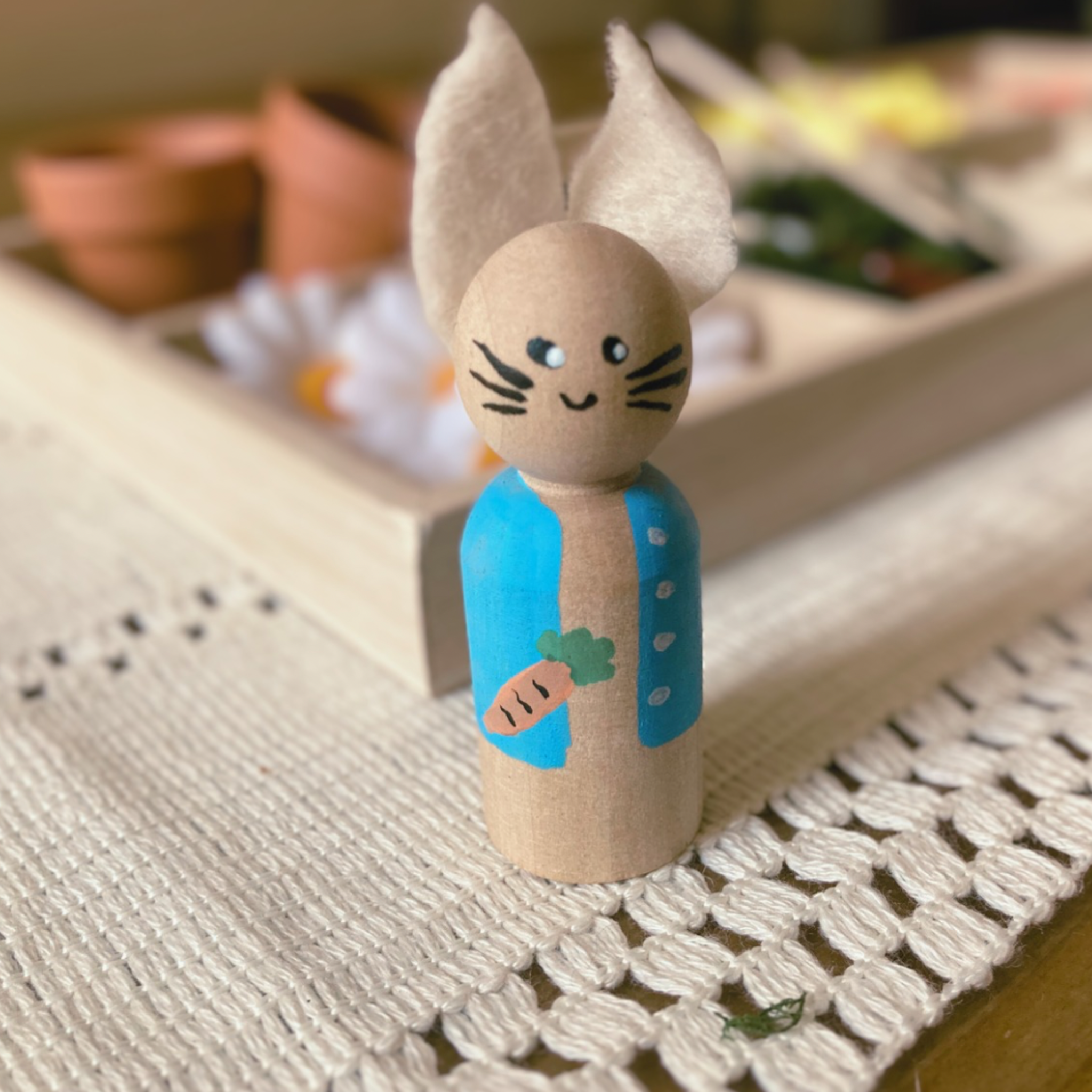 Spring gardening nature-based open and go preschool homeschool curriculum box including loose parts, tinker tray, and peter rabbit peg doll activity.