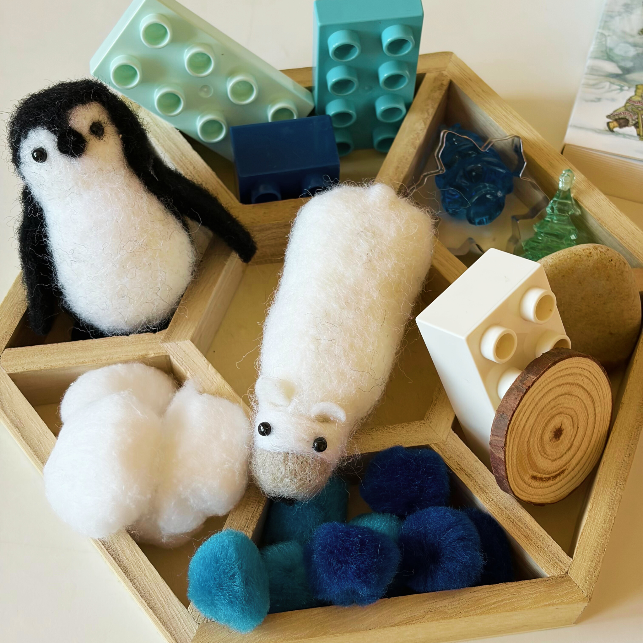 Preschool child completing a gentle winter phonics or notebooking activity from the Snowy Days & Polar Ways curriculum.