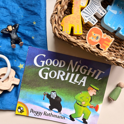 Good Night, Gorilla paired with wooden zoo animals and open-ended materials for imaginative play and story retelling.