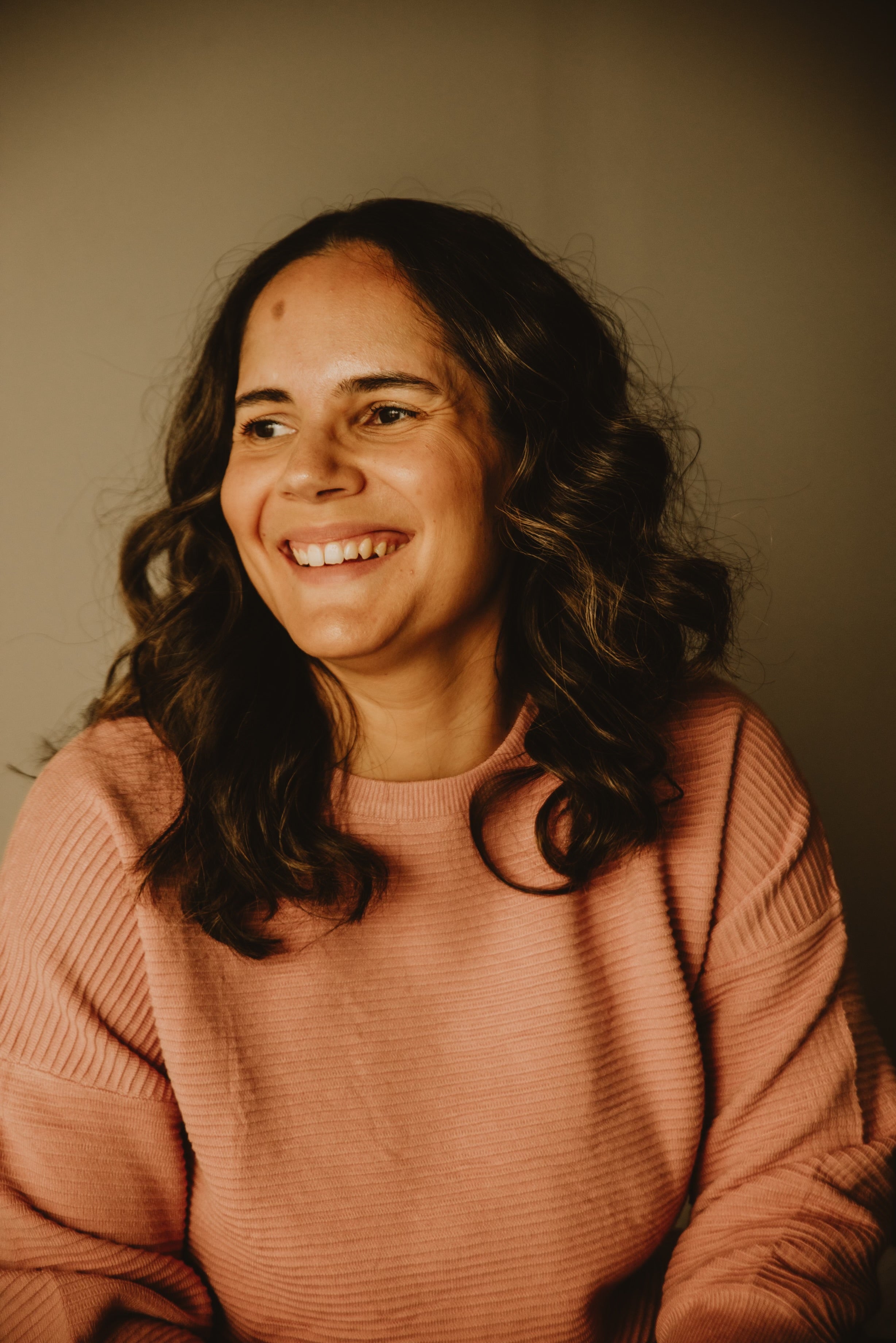 Portrait of Nancy Costa, founder of Acorn to Sprout, smiling warmly.