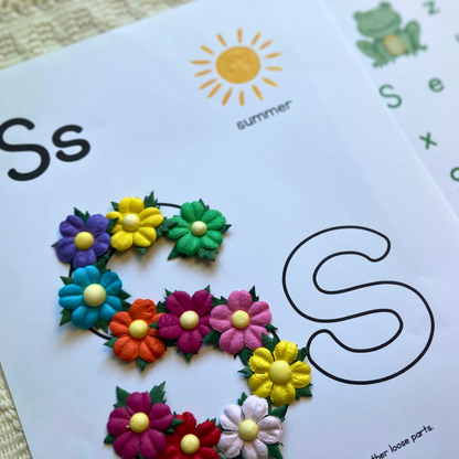 Tinker tray with seashells, sun, frog, and summer craft supplies from preschool homeschool box