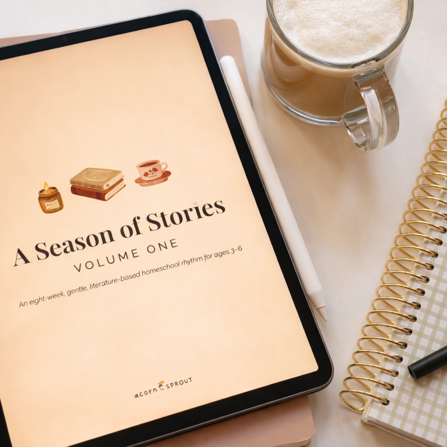 A Season of Stories Volume One displayed on an iPad beside a coffee mug and notebook, showing a gentle literature-based homeschool rhythm for ages 3–6.