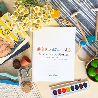 A Season of Stories Volume Two story-led preschool learning guide styled with books, art supplies, and hands-on play materials.