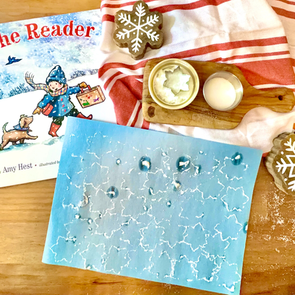 Winter art activity with The Reader picture book, snowflake materials, and an Acorn to Sprout story extension.