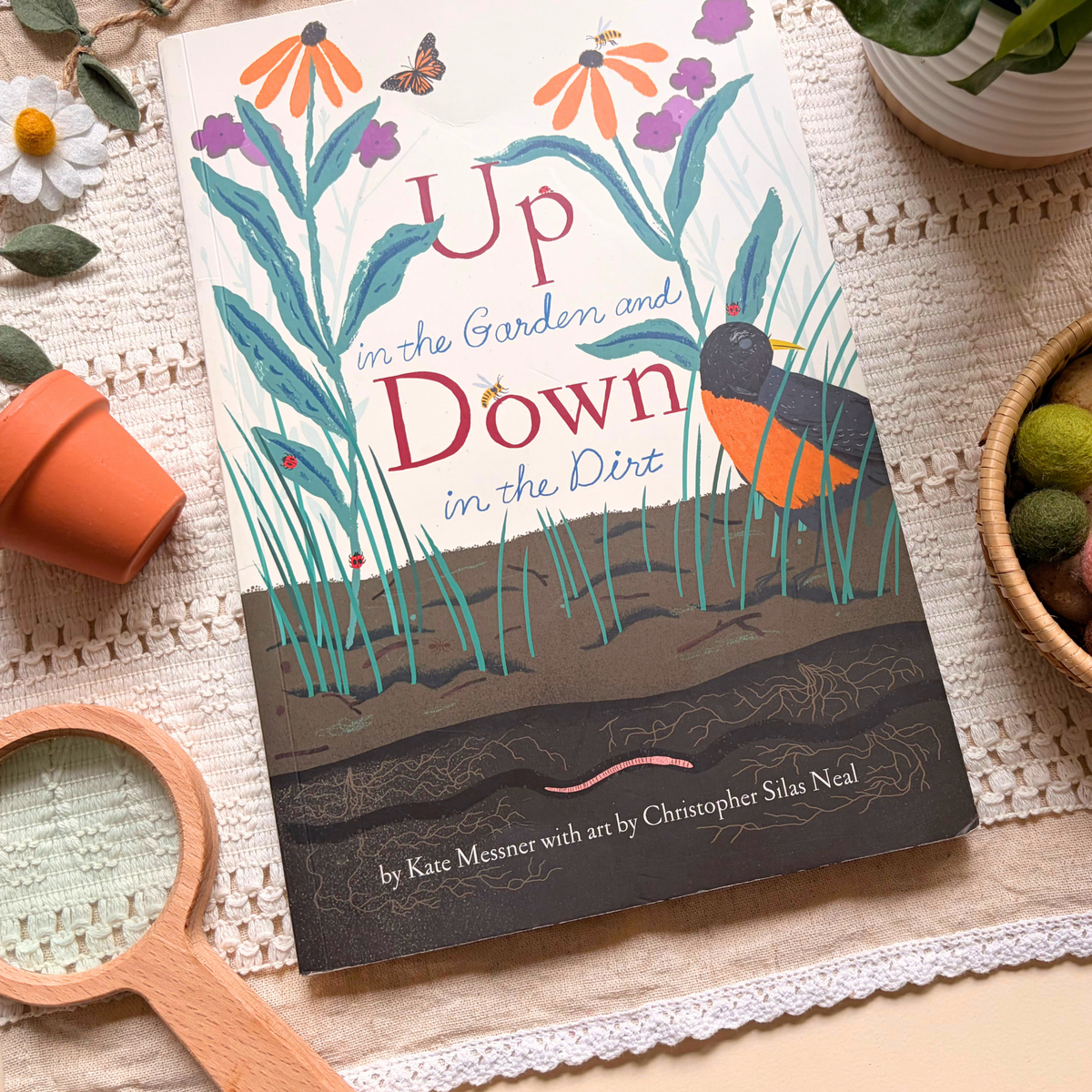 Up in the Garden and Down in the Dirt styled with simple nature materials for story-led preschool learning.